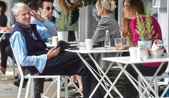 Tory peer Zac Goldsmith and 'Godiva' protester enjoy a coffee