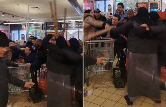 Bizarre moment raging shoppers throw rolls of Christmas wrapping paper at each other as brawl erupts in Aldi | The Sun