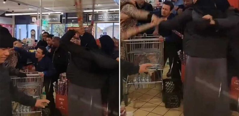 Bizarre moment raging shoppers throw rolls of Christmas wrapping paper at each other as brawl erupts in Aldi | The Sun