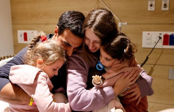Emotional moment girl is hugged tightly by family after being hostage