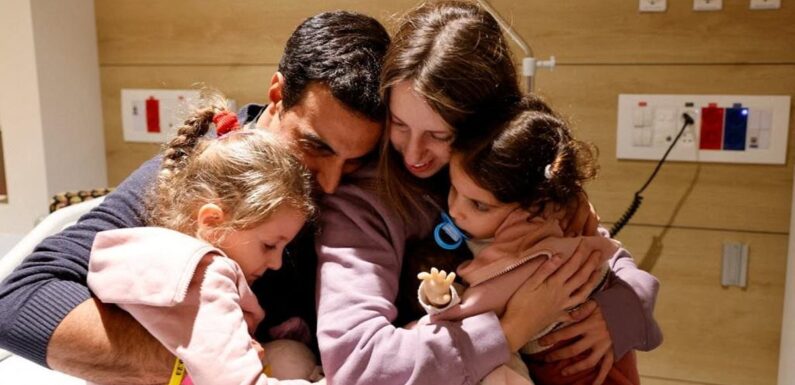 Emotional moment girl is hugged tightly by family after being hostage