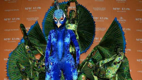 Heidi Klum dresses up as a PEACOCK at her annual party extravaganza