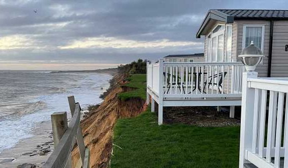 Holidaymakers are evacuated after cliff collapses into the sea