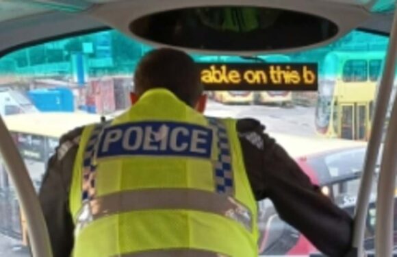Police ride double decker buses to catch drivers using mobile phones