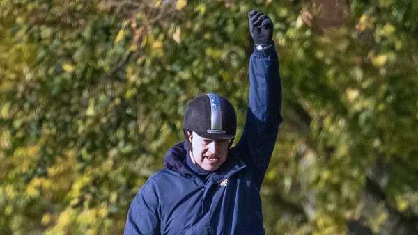 Prince Andrew punches the air as he goes for  horseride in Windsor