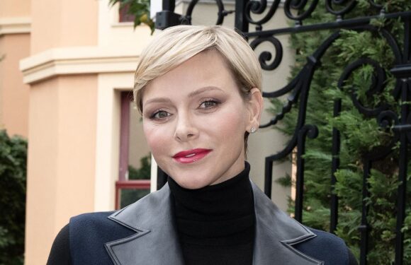 Princess Charlene looks stylish in black leather-trim coat