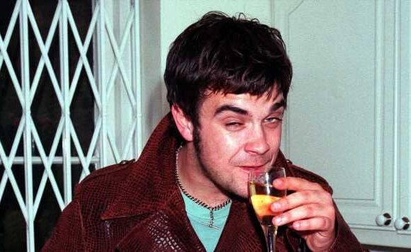 Robbie Williams near-death call as he admits cutting wrists during addiction