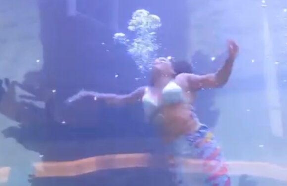 Terrifying moment ‘mermaid’ nearly DROWNS after her tail gets stuck in aquarium in front of horrified crowd – The Sun | The Sun