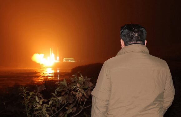 Tubby tyrant Kim Jong Un watches rocket launch of spy satellite