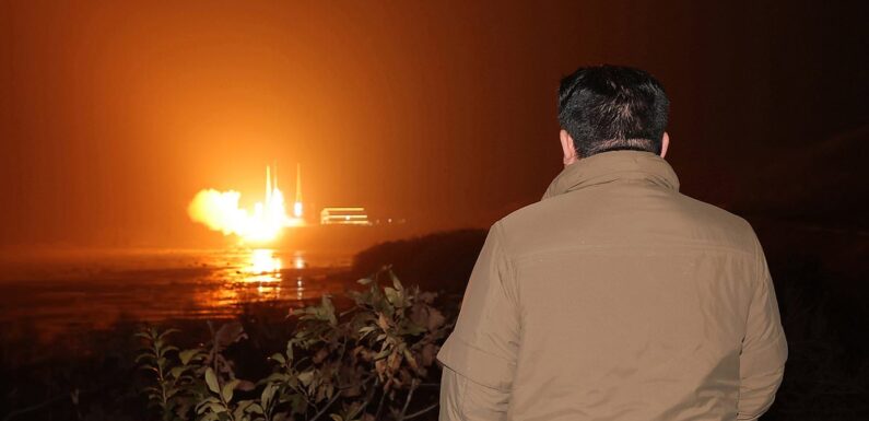 Tubby tyrant Kim Jong Un watches rocket launch of spy satellite