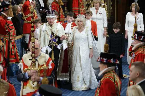 Why did Queen Camilla rewear her coronation gown at the opening of Parliament?