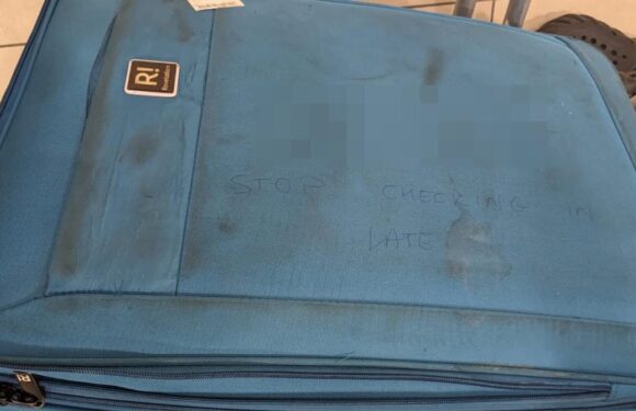 Airport worker sacked after writing sweary message on baby's suitcase