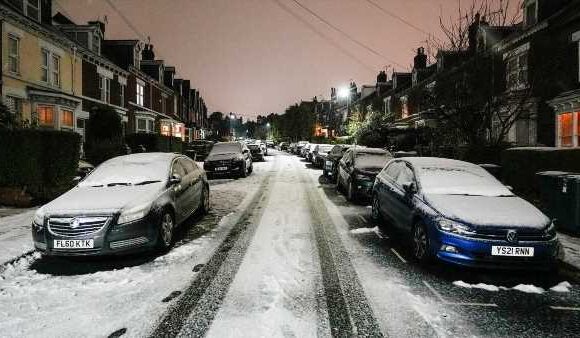 Brits don their SKIS as they battle to work on Ice Rink Monday