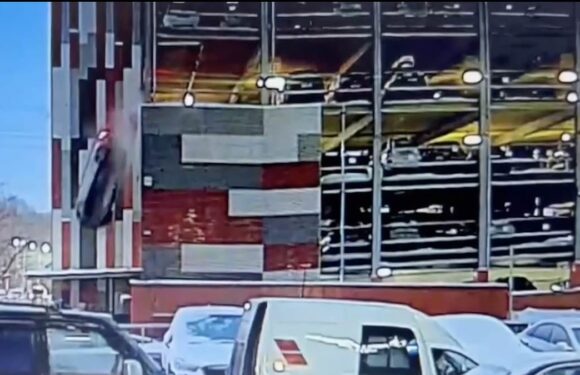 Driver safe after 40ft fall following crash through carpark barrier