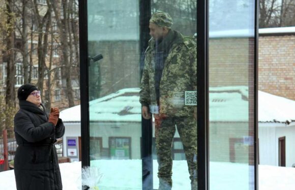 Grieving mum gazes at lifelike monument depicting war hero son — executed by Russians after declaring 'Glory to Ukraine' | The Sun