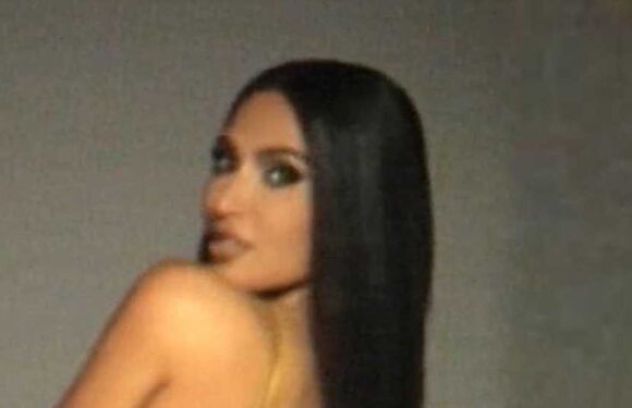 Kim Kardashian goes without underwear in skintight silk dress as she drops major career news in time for New Year's Eve | The Sun